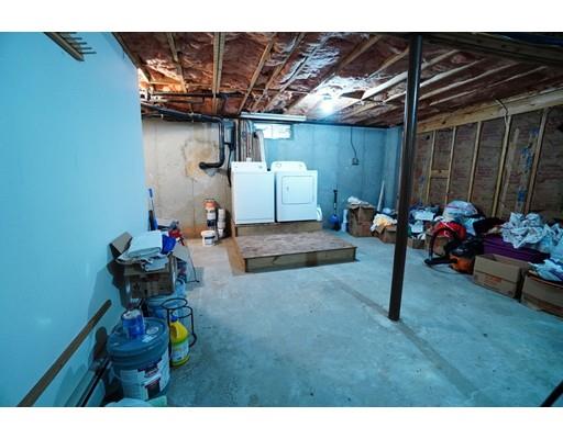 115 Fitzgerald Road Charlton, MA 01507 - Photo 20 of 24 a backyard of a house with table and chairs