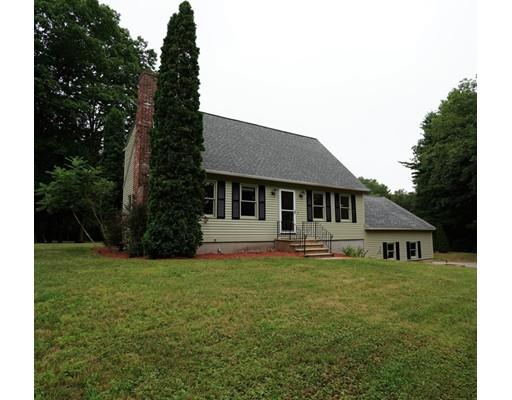 115 Fitzgerald Road Charlton, MA 01507 - Photo 2 of 24 a house that has a big yard with large trees