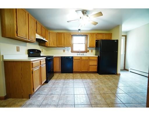 115 Fitzgerald Road Charlton, MA 01507 - Photo 5 of 24 a kitchen with stainless steel appliances granite countertop a stove a refrigerator a sink dishwasher and a refrigerator