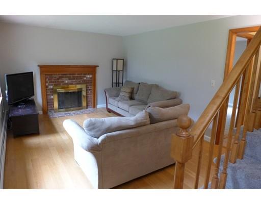 115 Fitzgerald Road Charlton, MA 01507 - Photo 8 of 24 a living room with furniture and a fireplace