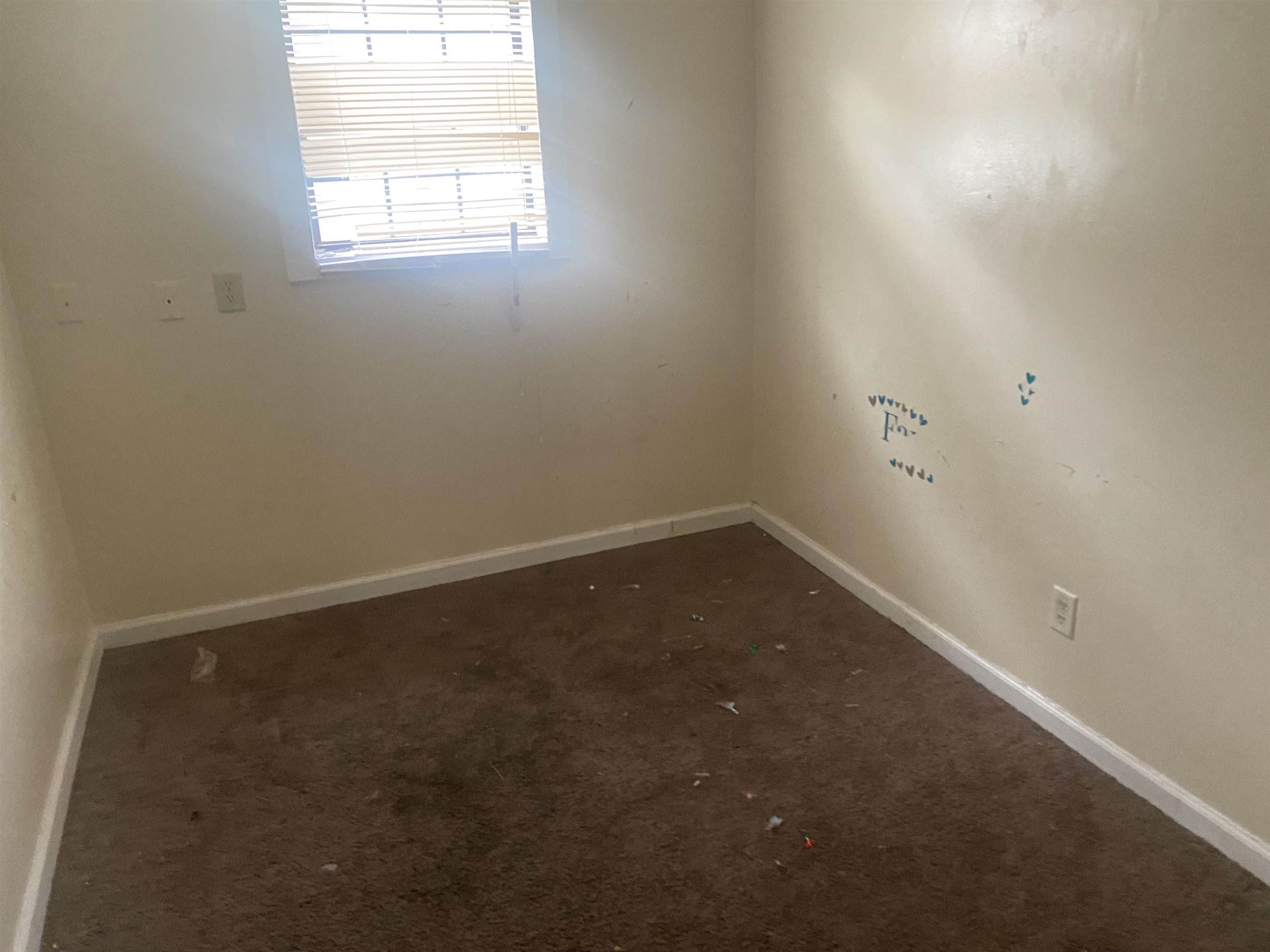 4795 Allrand Road Memphis, TN 38118 - Photo 17 of 21 an empty room with a window
