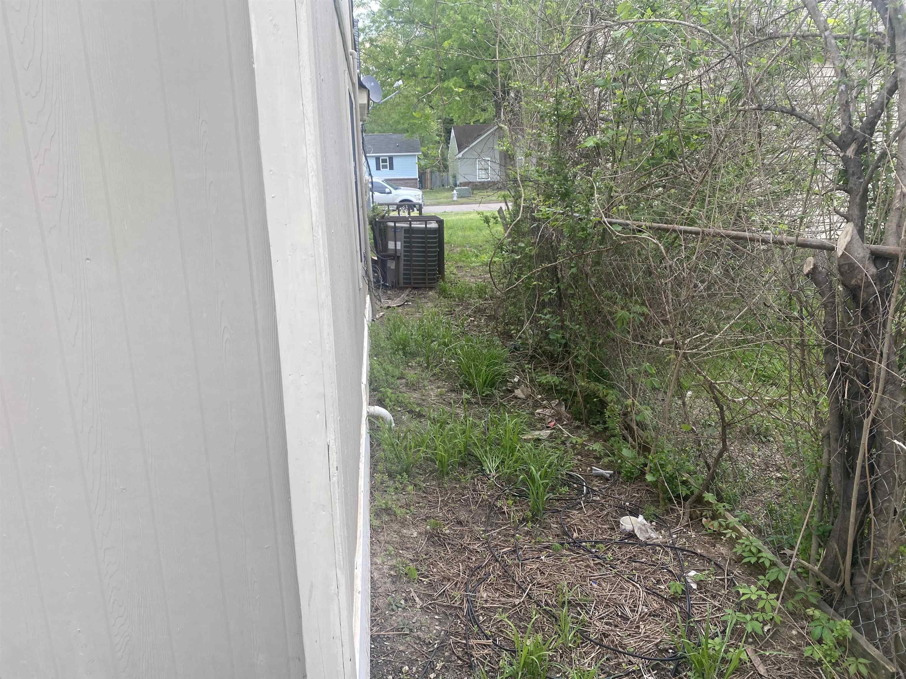 4795 Allrand Road Memphis, TN 38118 - Photo 8 of 21 a view of a forest from a bathroom