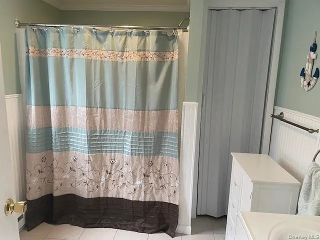 a view of a door and chair in the bathroom