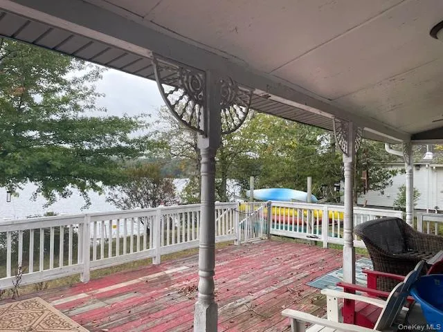 a view of a two chairs and table in the deck