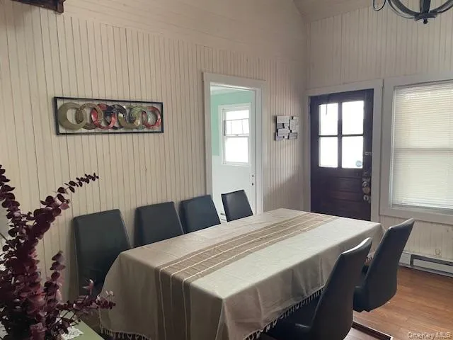 a bedroom with a bed and a table with chair