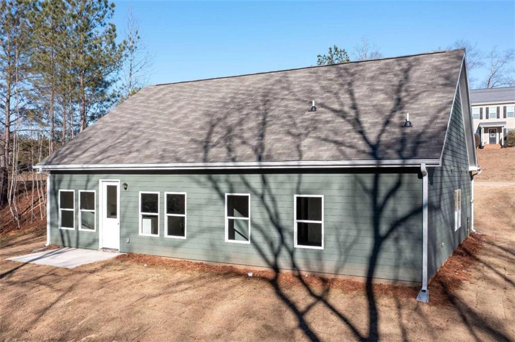96 Rosemary Way Buchanan, GA 30113 - Photo 6 of 31 a backyard of a house with table and chairs