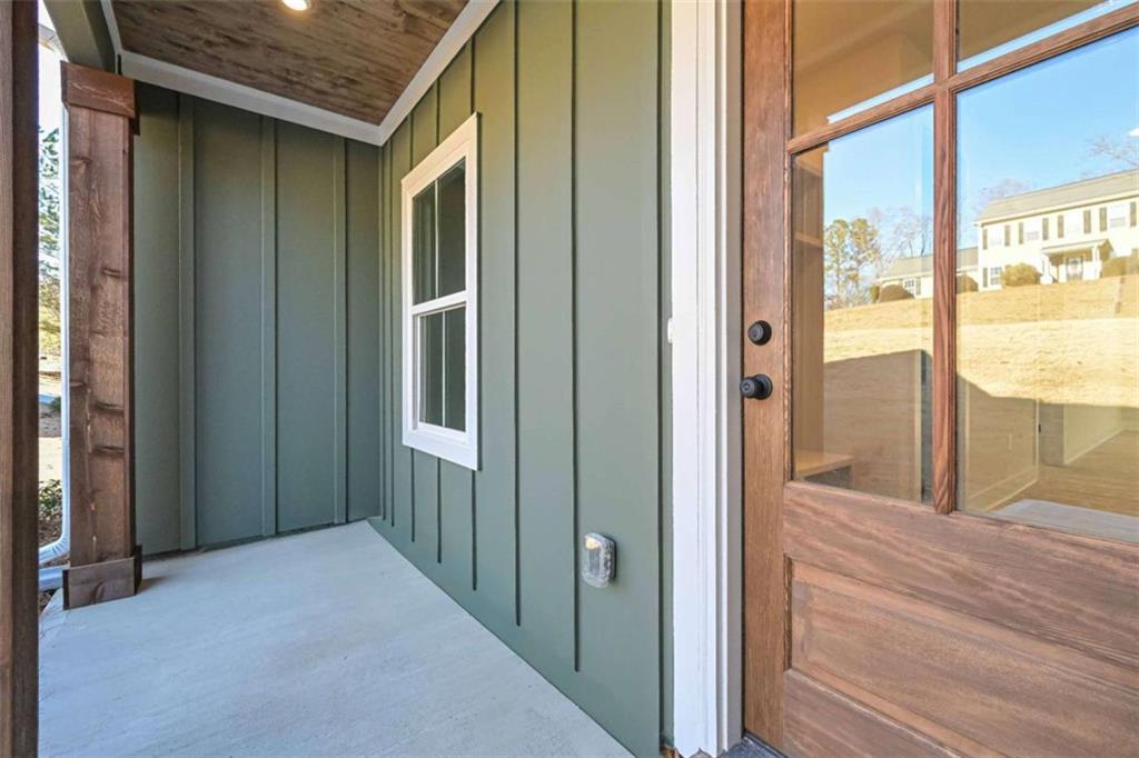 96 Rosemary Way Buchanan, GA 30113 - Photo 8 of 31 a view of a hallway with wooden floor and windows