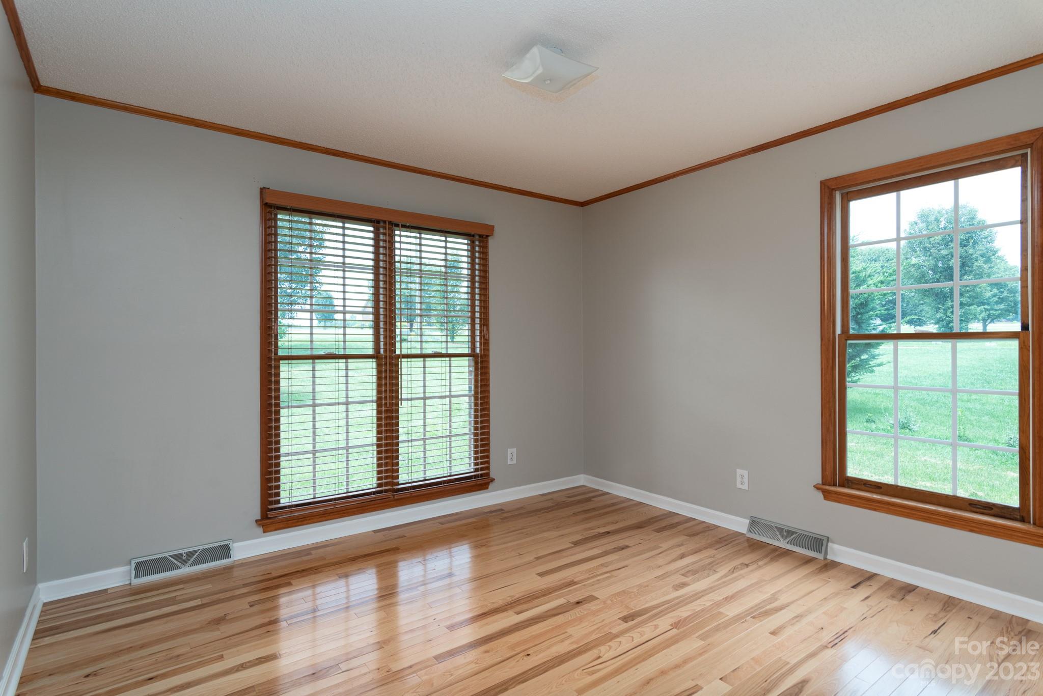 920 Bethel Church Road Lincolnton, NC 28092 - Photo 19 of 27 a view of an empty room with wooden floor and a window