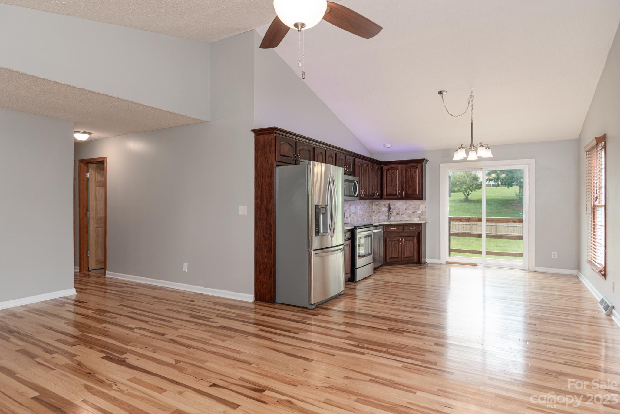 920 Bethel Church Road Lincolnton, NC 28092 - Photo 8 of 27 a view of a kitchen with furniture and wooden floor