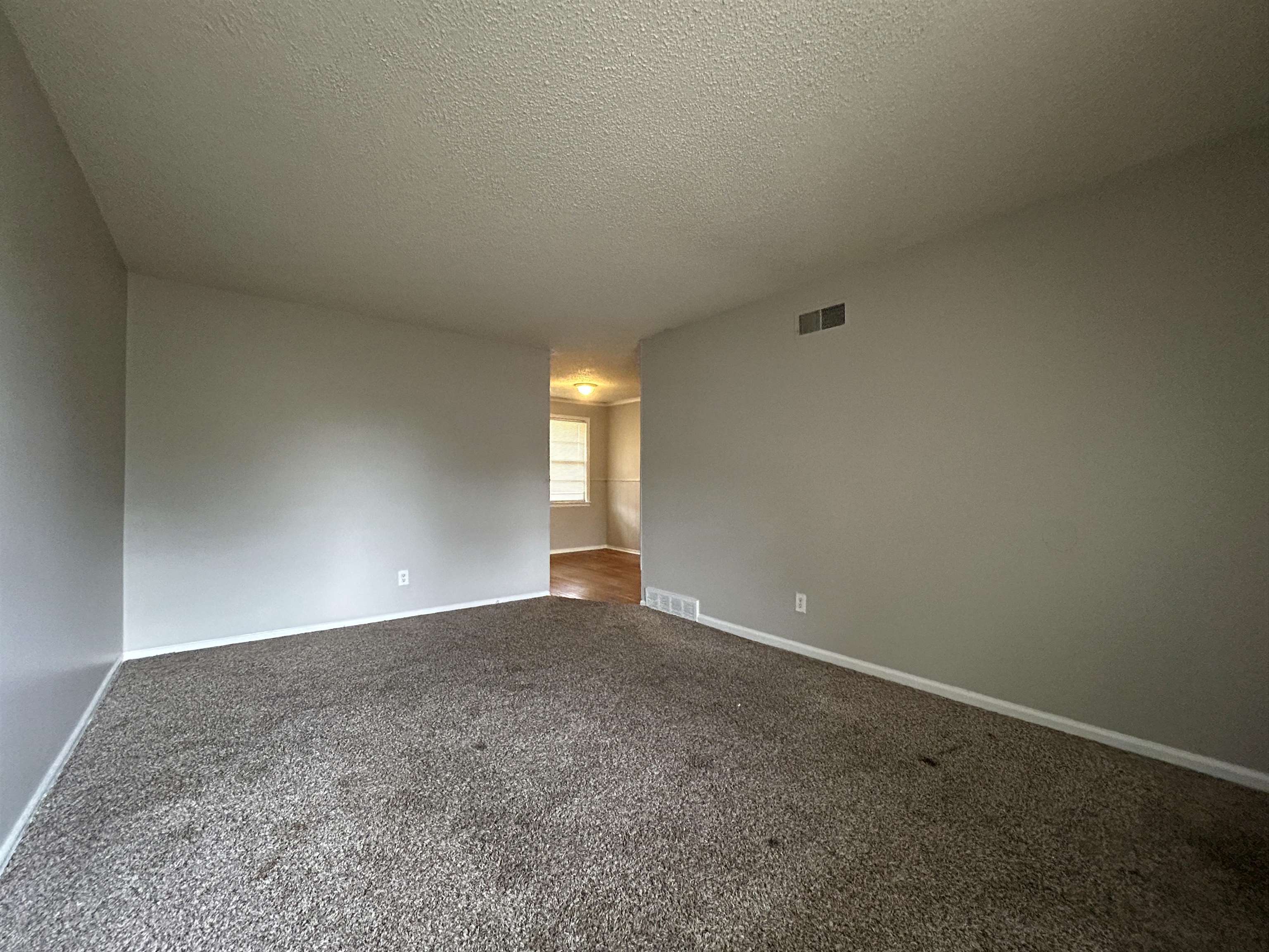 1809 Cherry Road Memphis, TN 38111 - Photo 2 of 16 a view of an empty room with a window