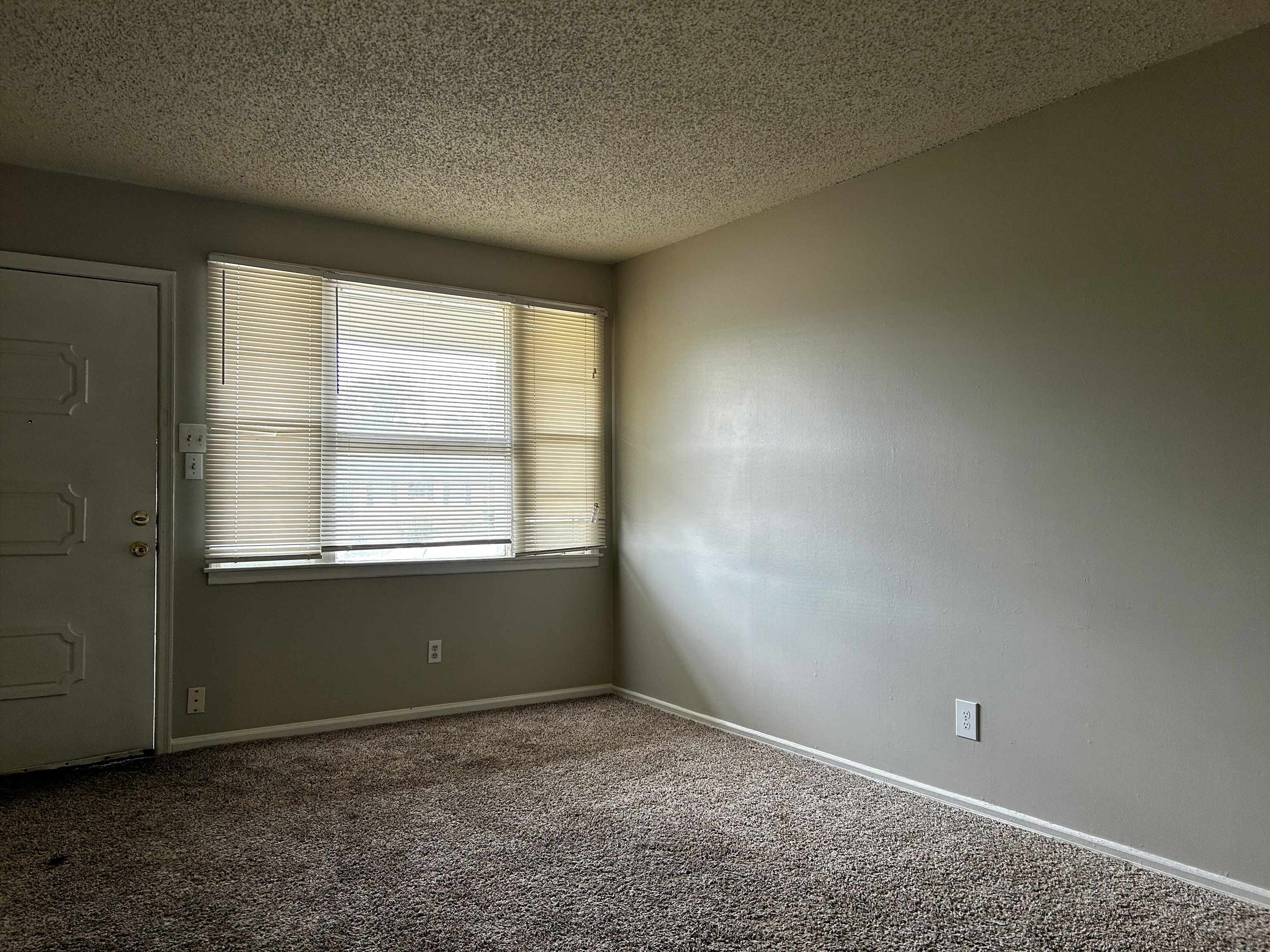 1809 Cherry Road Memphis, TN 38111 - Photo 3 of 16 an empty room with a window