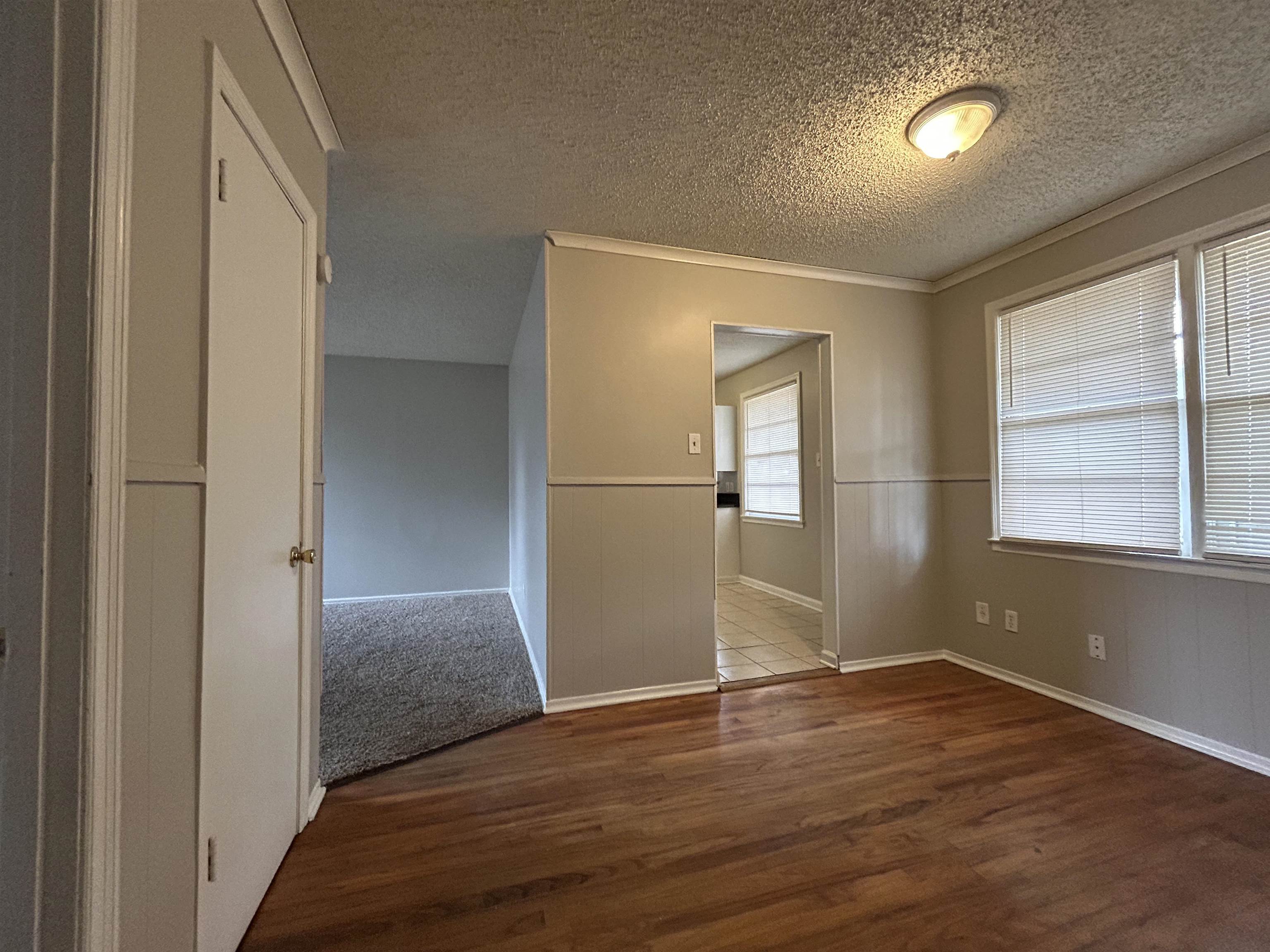 1809 Cherry Road Memphis, TN 38111 - Photo 4 of 16 a view of empty room with wooden floor and fan