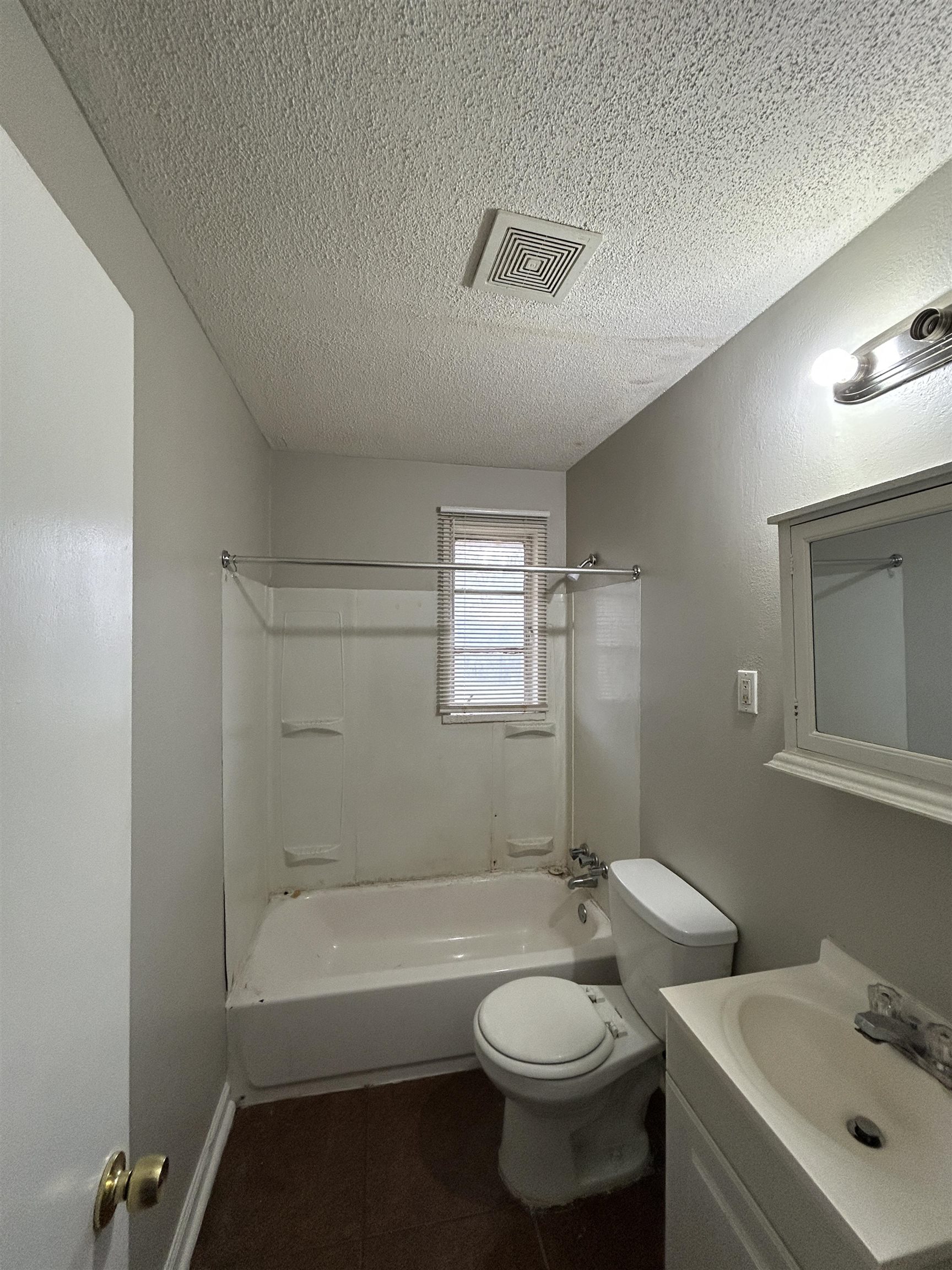 1809 Cherry Road Memphis, TN 38111 - Photo 7 of 16 a bathroom with a sink toilet and shower