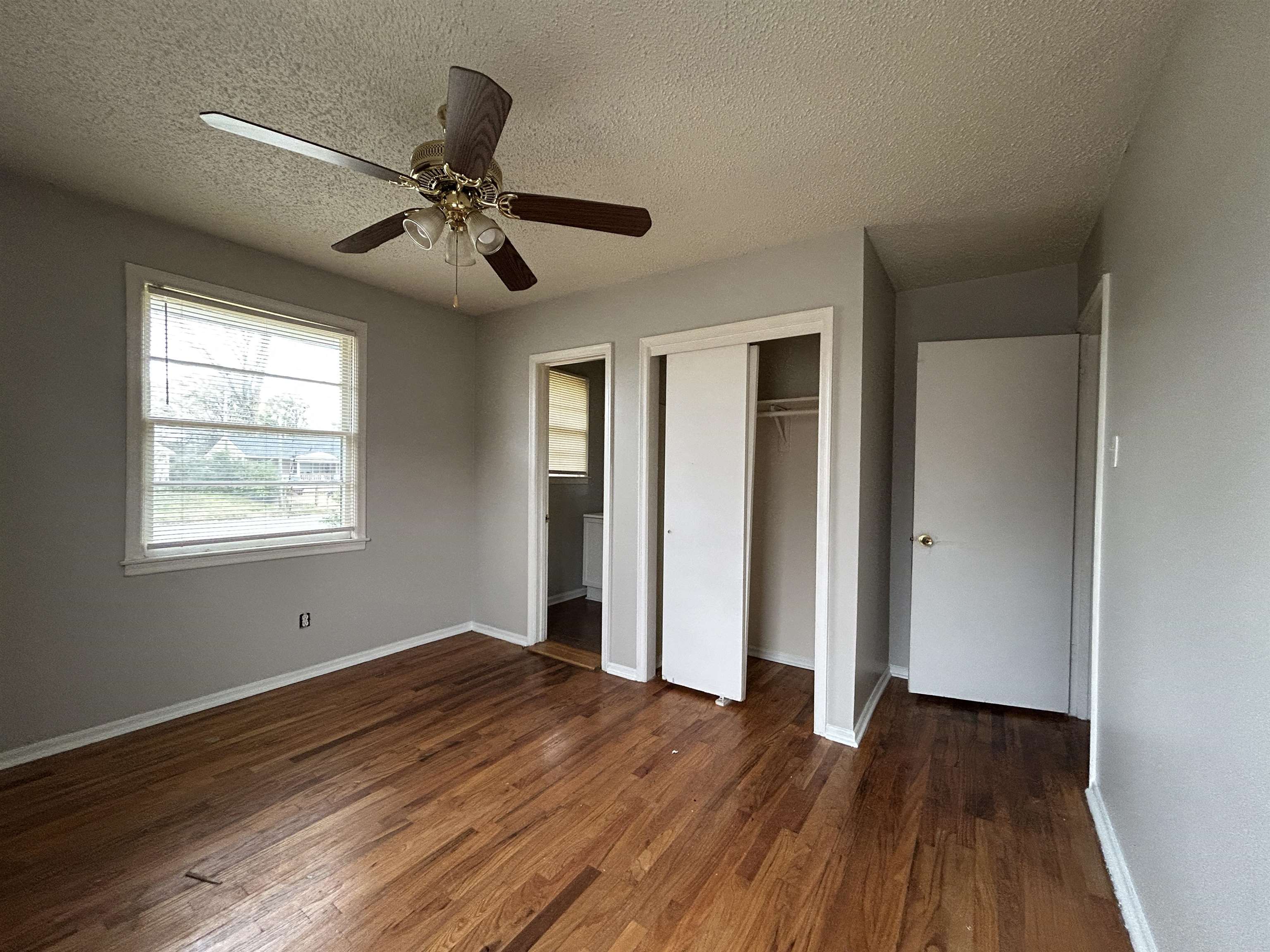 1809 Cherry Road Memphis, TN 38111 - Photo 9 of 16 a view of empty room with wooden floor and fan