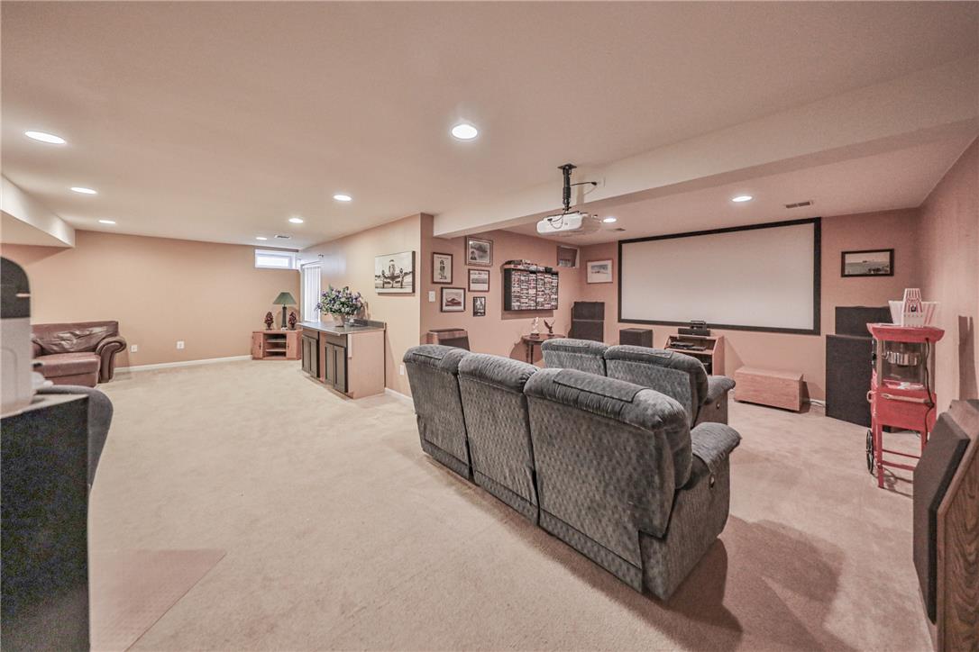 138 Clover Hollow Road Easton, PA 18045 - Photo 68 of 95 A well-lit entertainment space awaits movie nights with plush seating and a large projection screen.
