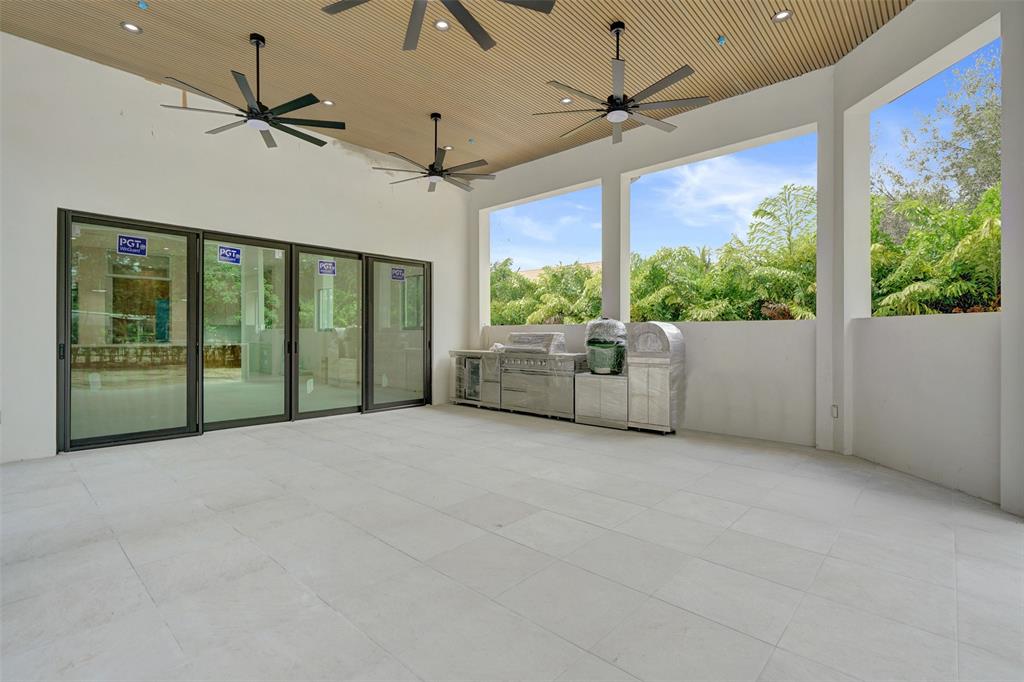 11951 Southwest 3rd Street Plantation, FL 33325 - Photo 16 of 59 a view of an empty room with a window and ceiling fan