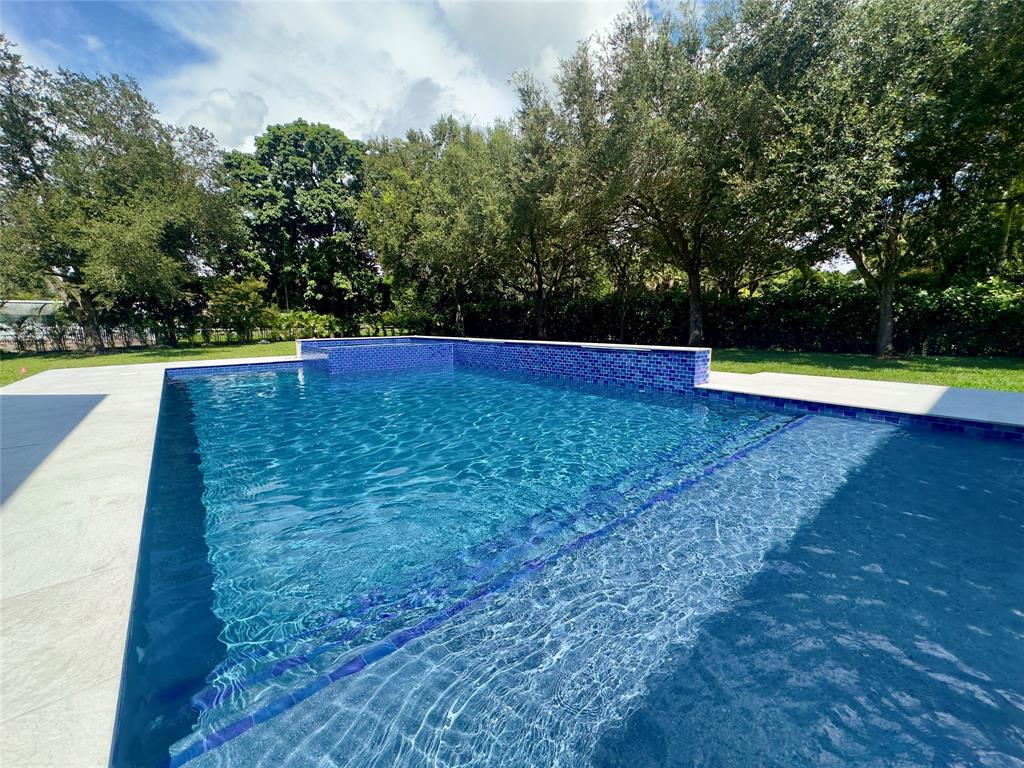 11951 Southwest 3rd Street Plantation, FL 33325 - Photo 19 of 59 a view of swimming pool with an outdoor space