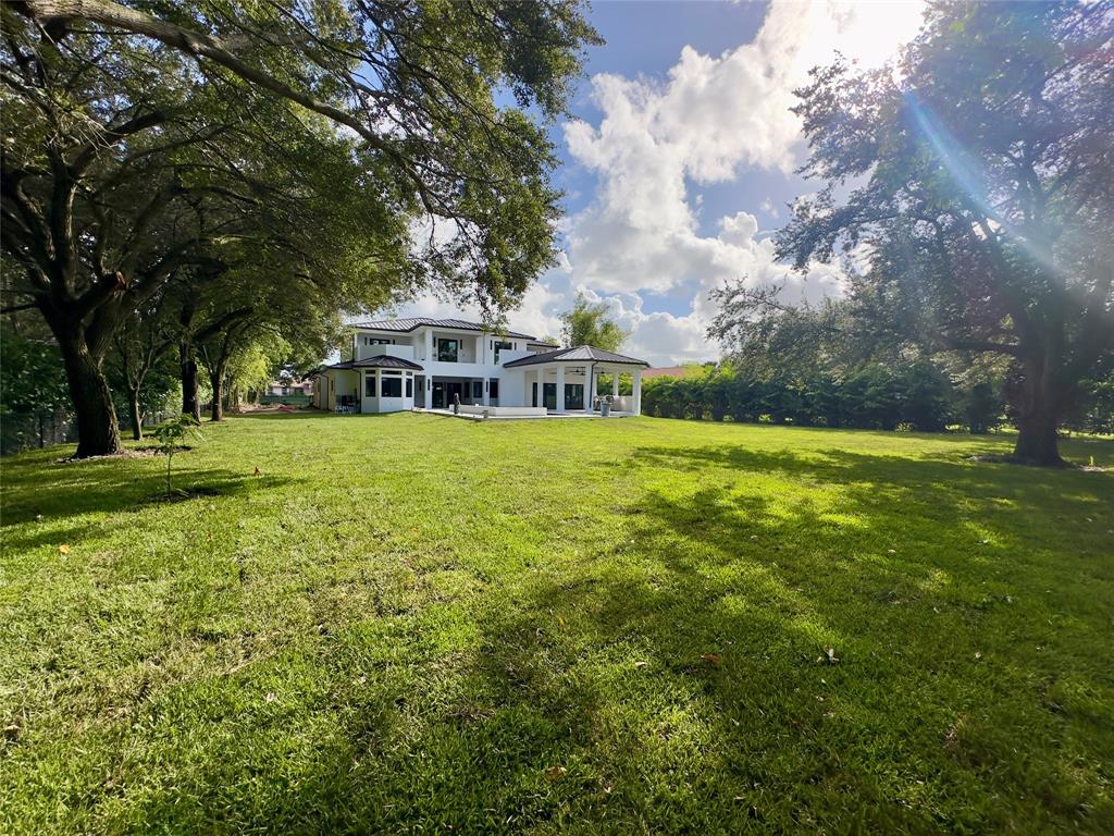 11951 Southwest 3rd Street Plantation, FL 33325 - Photo 22 of 59 a view of a house with a big yard