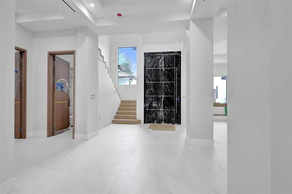11951 Southwest 3rd Street Plantation, FL 33325 - Photo 3 of 59 wooden floor in an empty room with windows