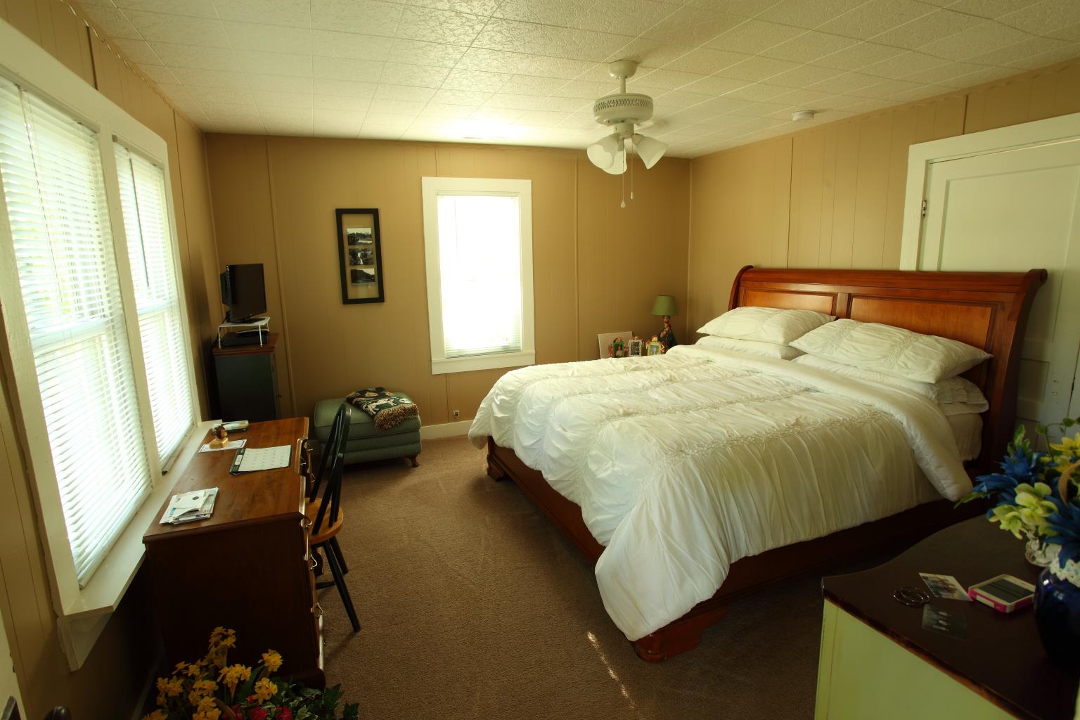 225 Franklin Road Lebanon, TN 37087 - Photo 20 of 21 a bedroom with a bed and a chandelier
