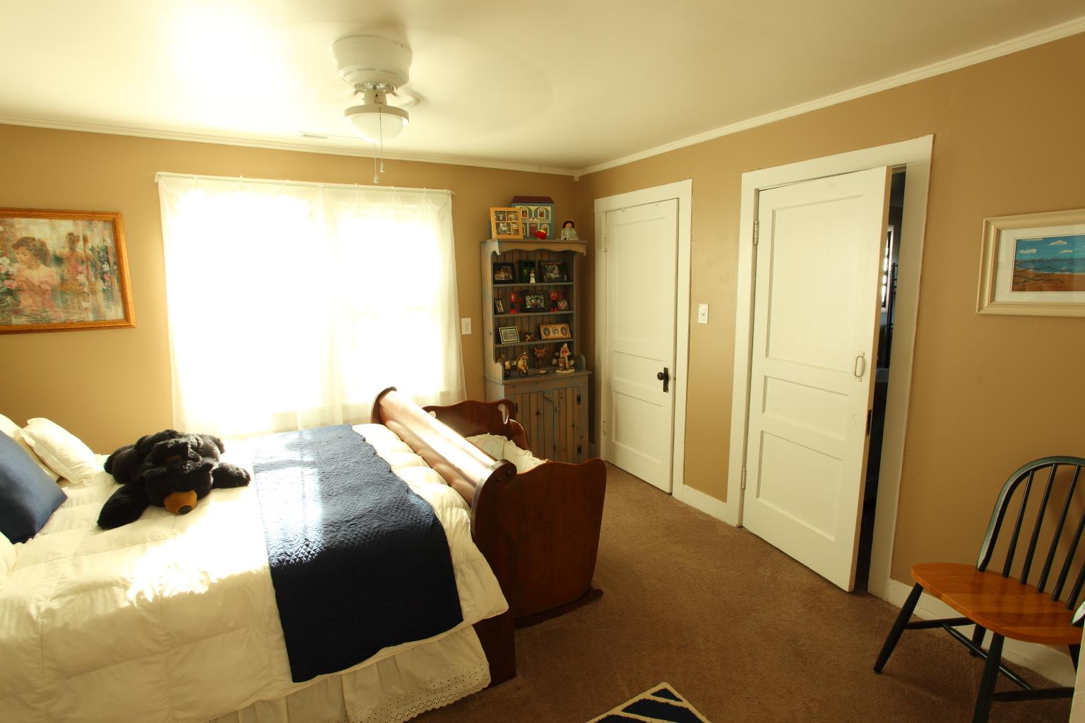 225 Franklin Road Lebanon, TN 37087 - Photo 6 of 21 a bedroom with a bed and a chair