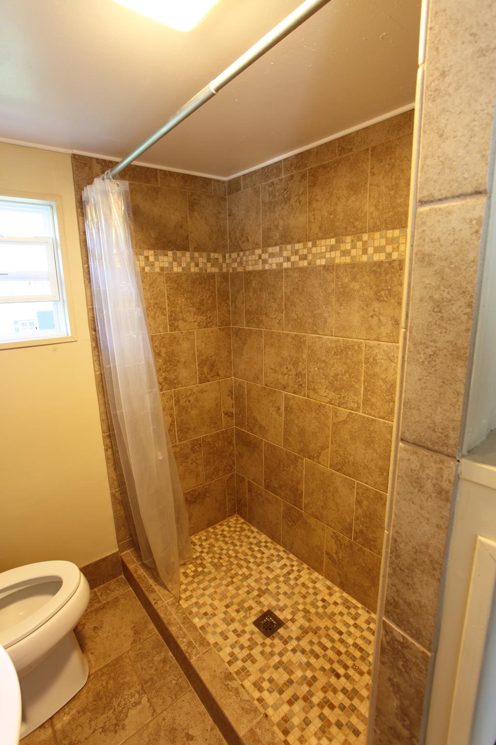 225 Franklin Road Lebanon, TN 37087 - Photo 8 of 21 a bathroom with a shower and toilet