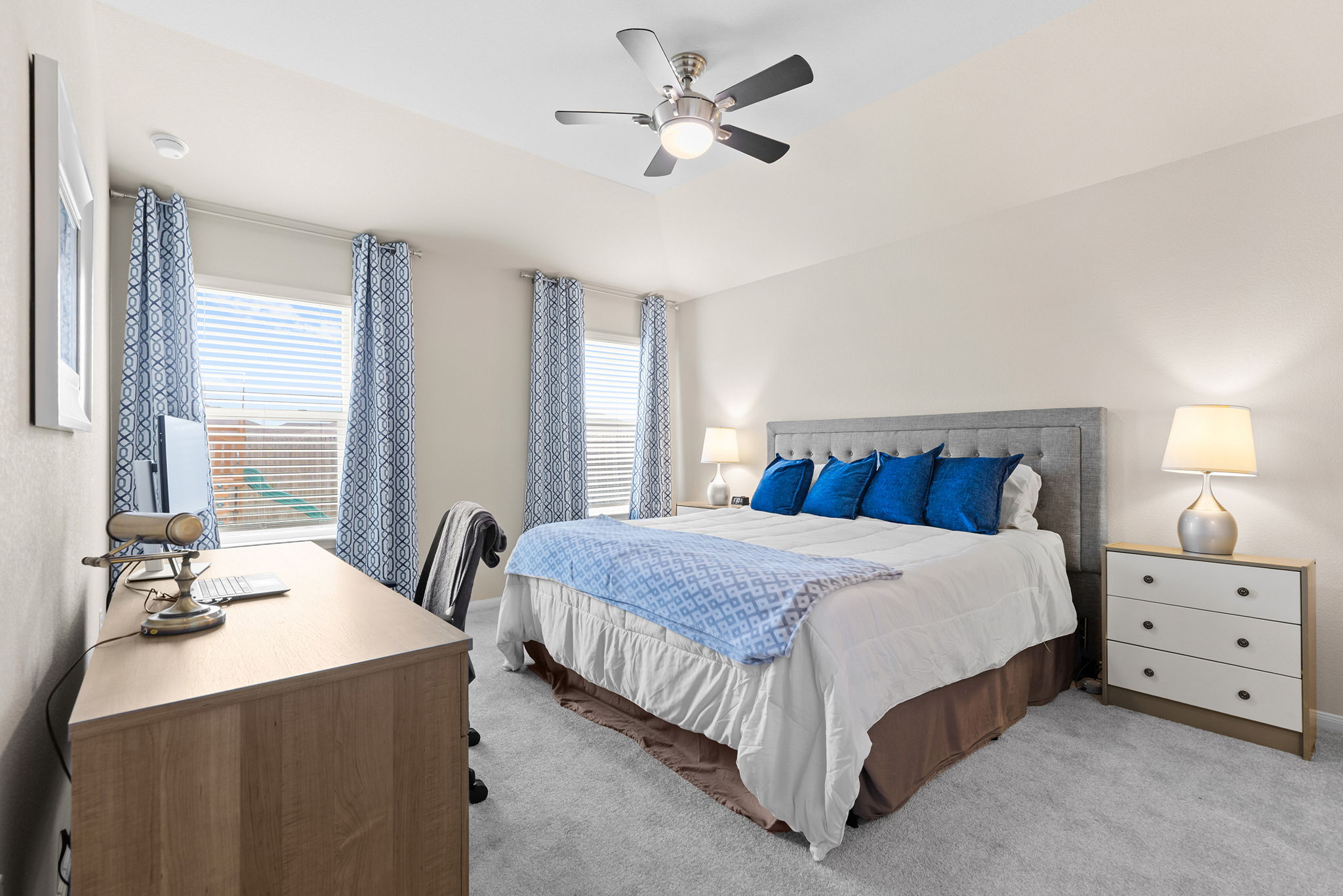 404 Cassandra Drive Hutto, TX 78634 - Photo 15 of 40 Bedroom featuring light colored carpet, a ceiling fan, and an office area