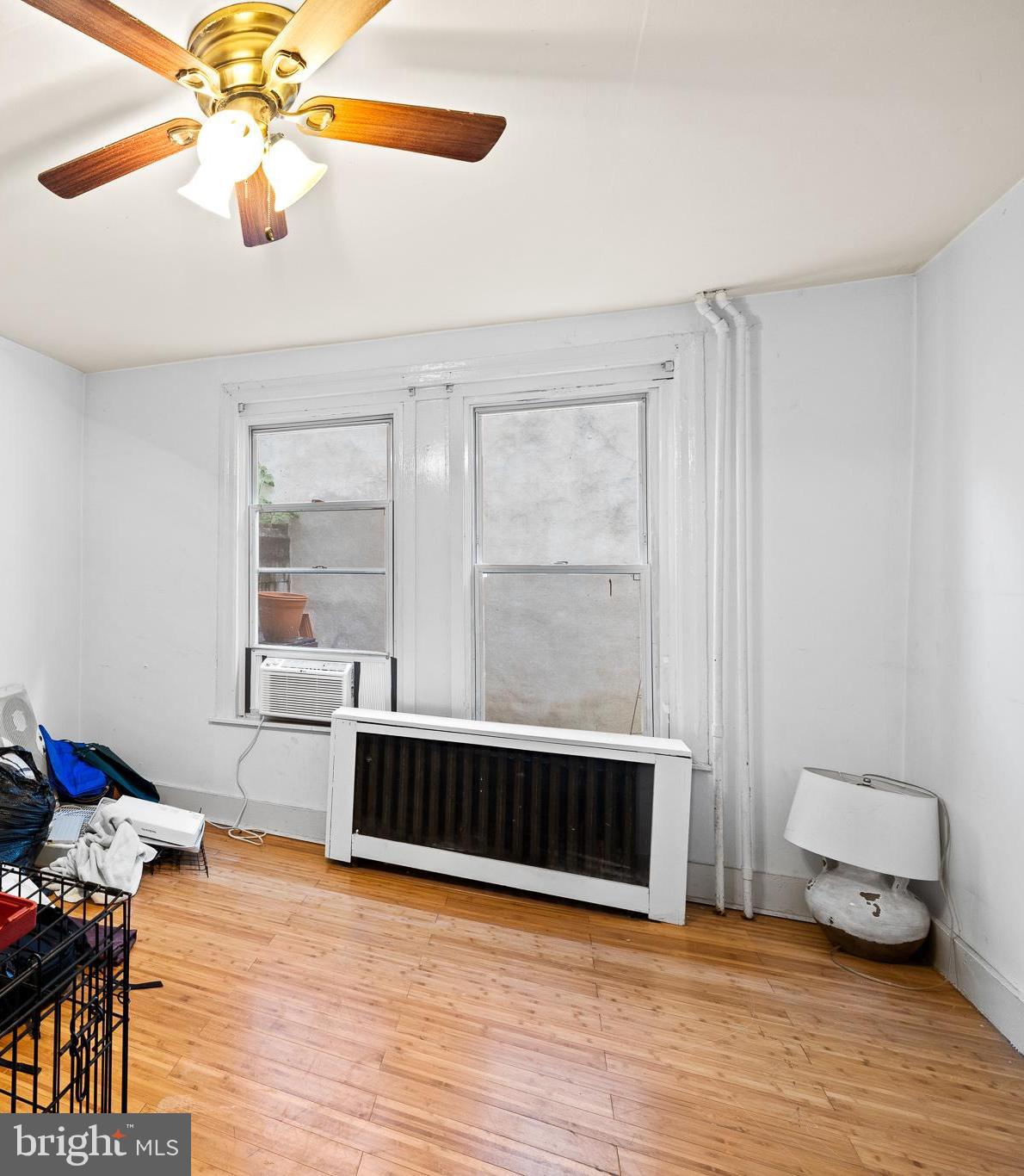 339 Christian Street, Unit 1 Philadelphia, PA 19147 - Photo 4 of 10 a living room with furniture and a chandelier