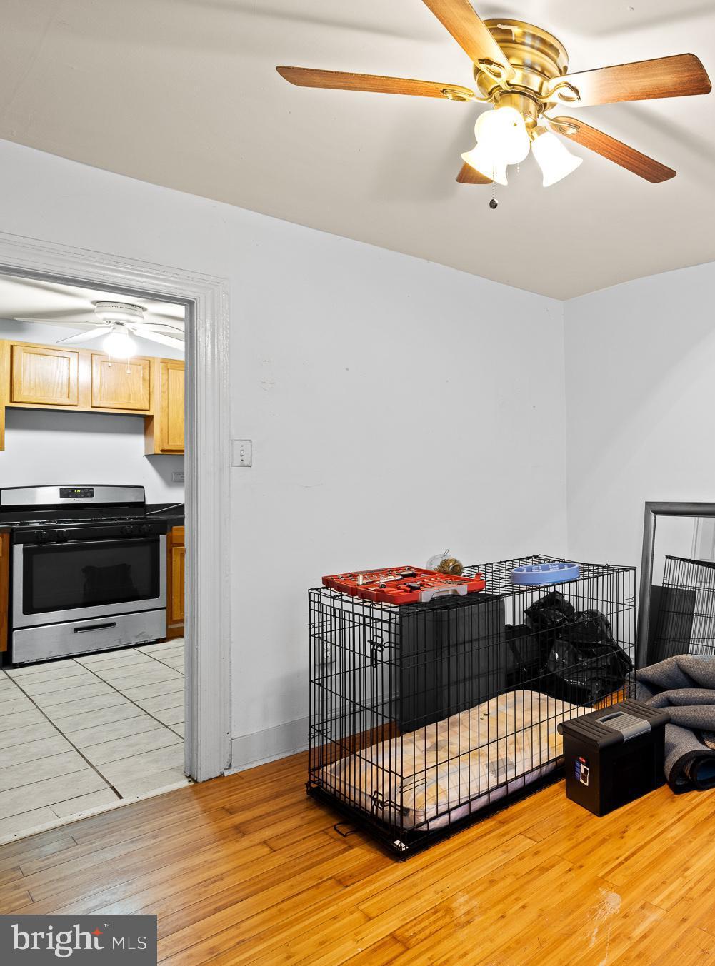 339 Christian Street, Unit 1 Philadelphia, PA 19147 - Photo 5 of 10 a bedroom with a bed and a chandelier