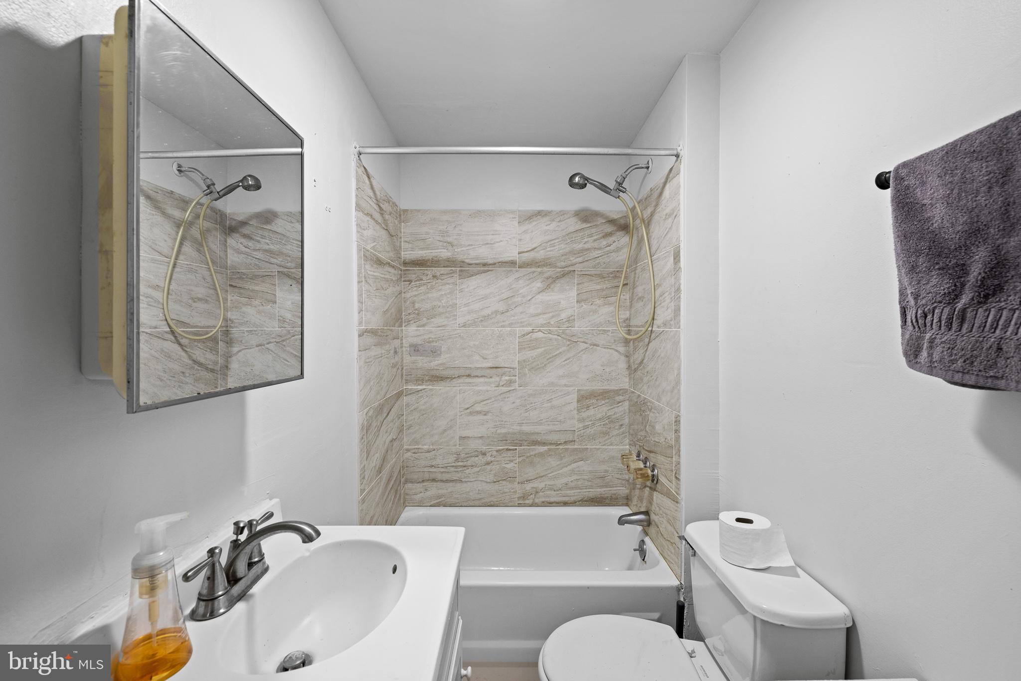 339 Christian Street, Unit 1 Philadelphia, PA 19147 - Photo 9 of 10 a bathroom with a sink toilet and shower
