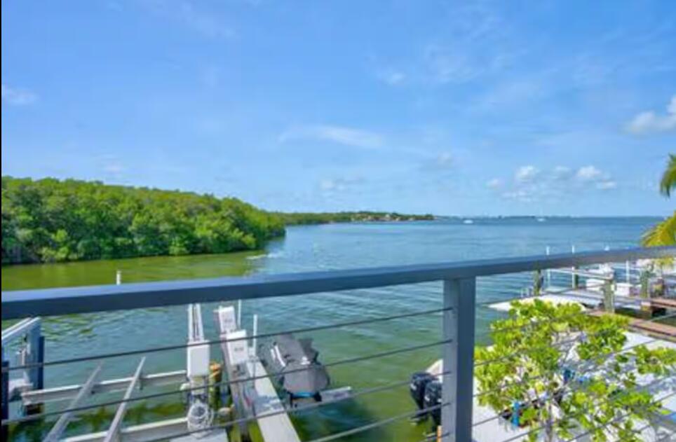 325 Calusa Street, Unit 231 Key Largo, FL 33037 - Photo 12 of 36 a view of a lake from a balcony with outdoor space