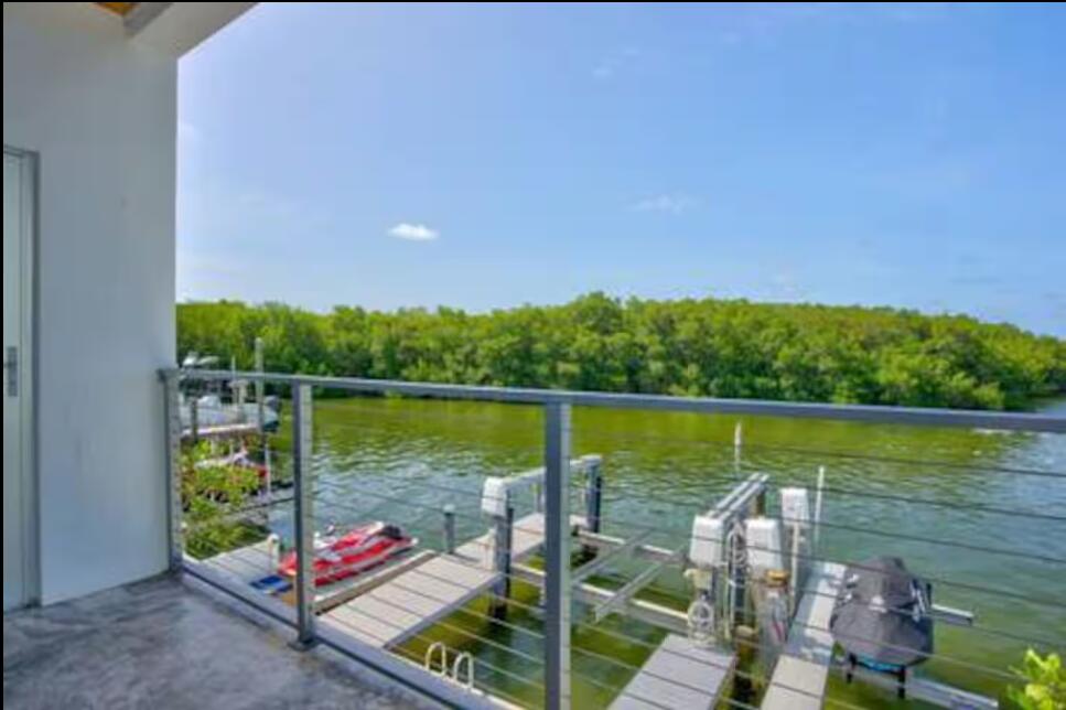 325 Calusa Street, Unit 231 Key Largo, FL 33037 - Photo 13 of 36 a view of a lake from a balcony