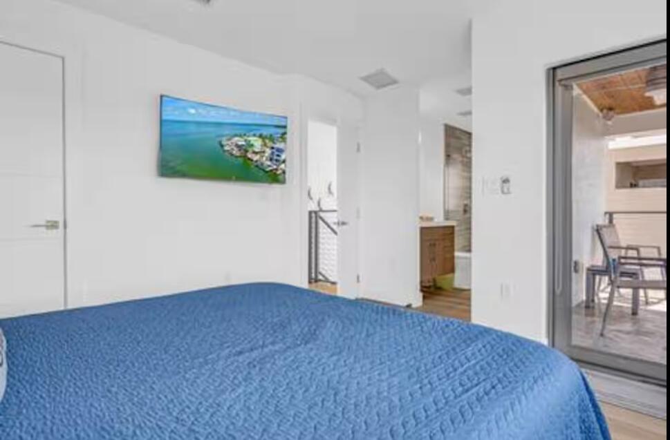 325 Calusa Street, Unit 231 Key Largo, FL 33037 - Photo 16 of 36 a view of livingroom with hardwood floor and dining room