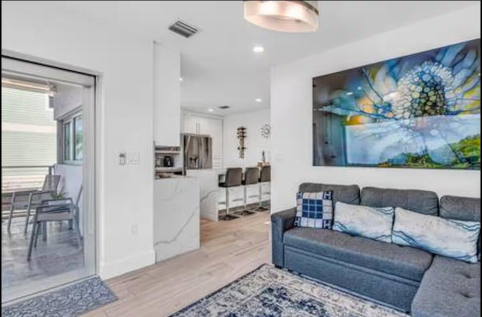 325 Calusa Street, Unit 231 Key Largo, FL 33037 - Photo 20 of 36 a living room with furniture and a painting on the wall