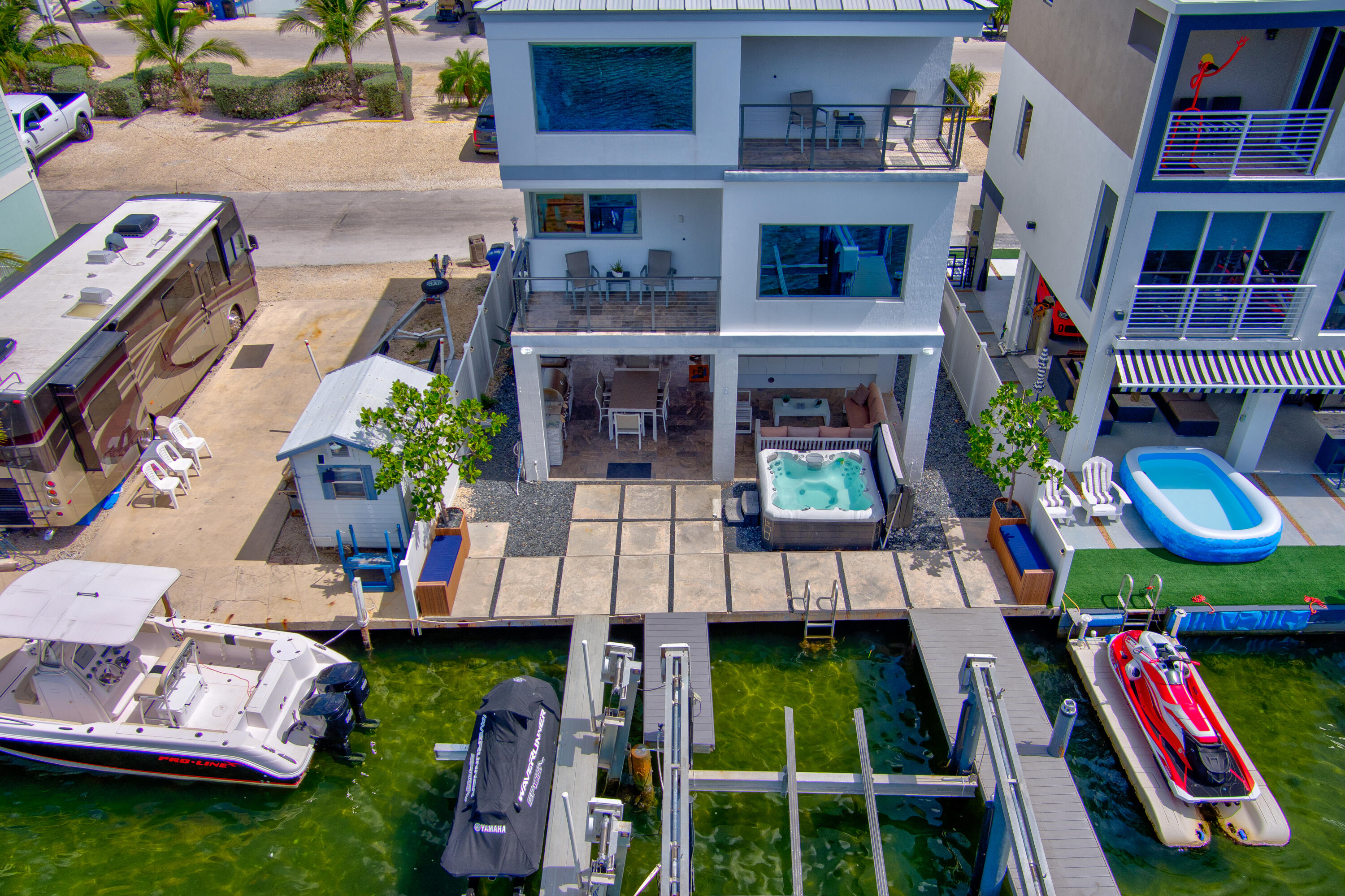 325 Calusa Street, Unit 231 Key Largo, FL 33037 - Photo 28 of 36 a view of multiple houses with a yard