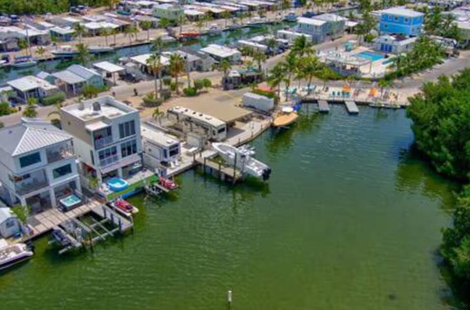 325 Calusa Street, Unit 231 Key Largo, FL 33037 - Photo 31 of 36 an aerial view of residential houses with outdoor space and swimming pool