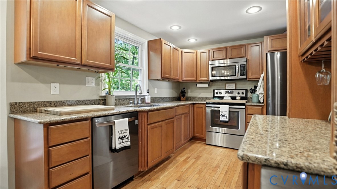 9743 Snowhill Road Richmond, VA 23235 - Photo 13 of 48 Kitchen with stainless steel appliances, light sto