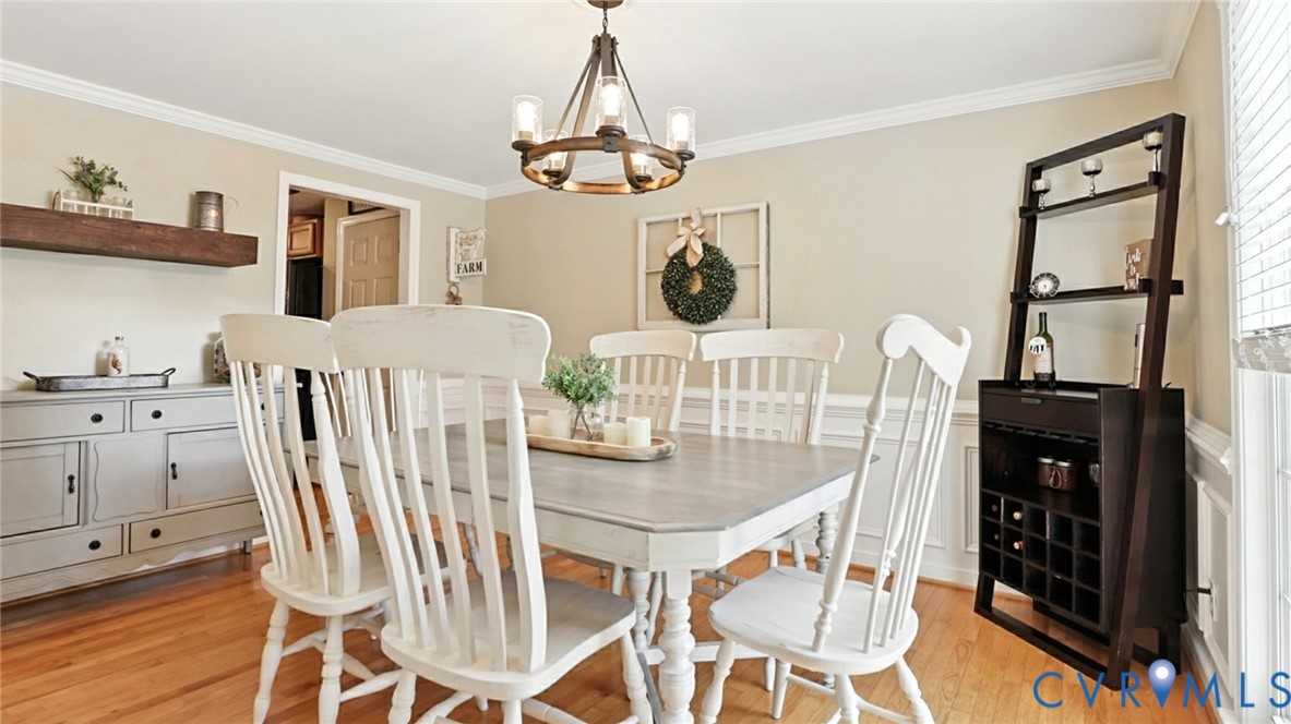 9743 Snowhill Road Richmond, VA 23235 - Photo 16 of 48 Dining room featuring ornamental molding, light wo