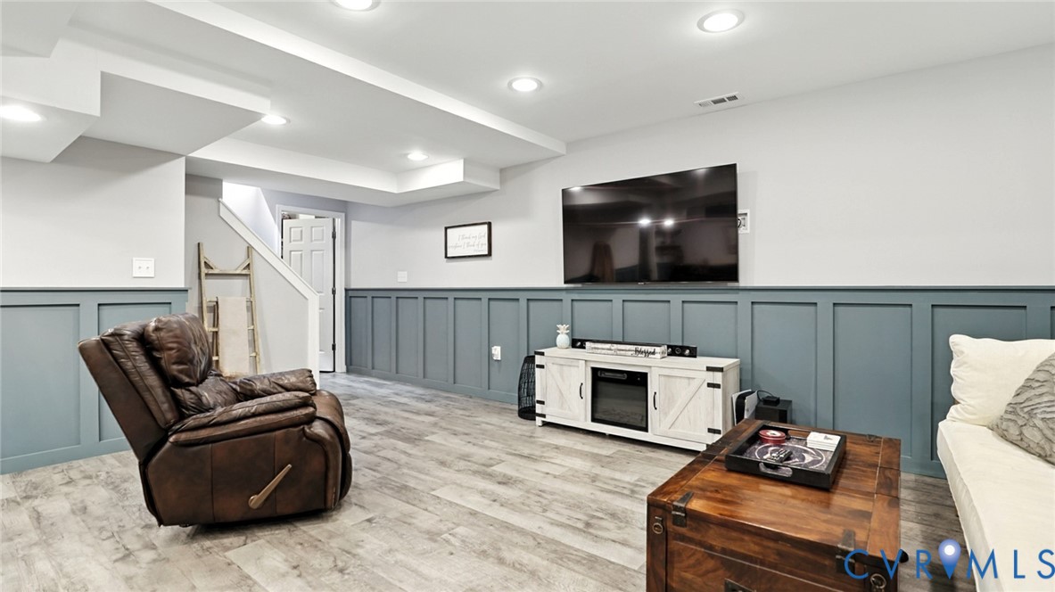 9743 Snowhill Road Richmond, VA 23235 - Photo 23 of 48 Living area with light wood-type flooring, a decor