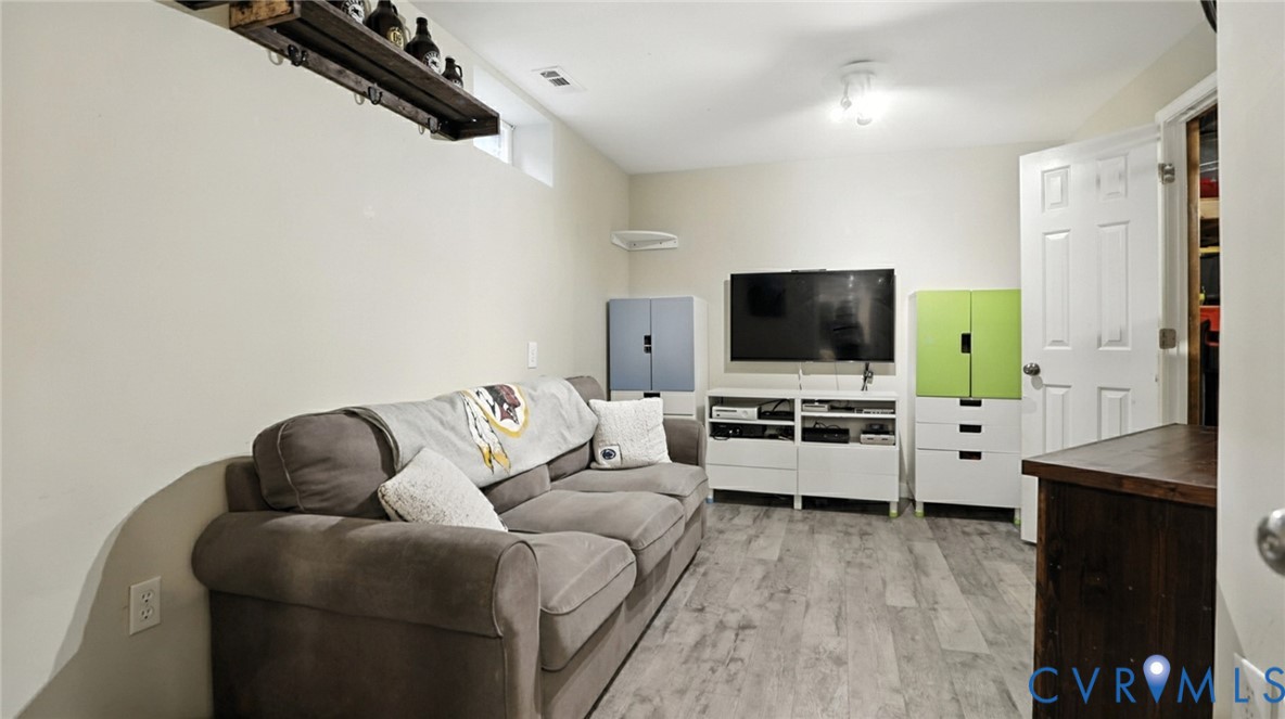 9743 Snowhill Road Richmond, VA 23235 - Photo 28 of 48 Living room with light wood-style floors