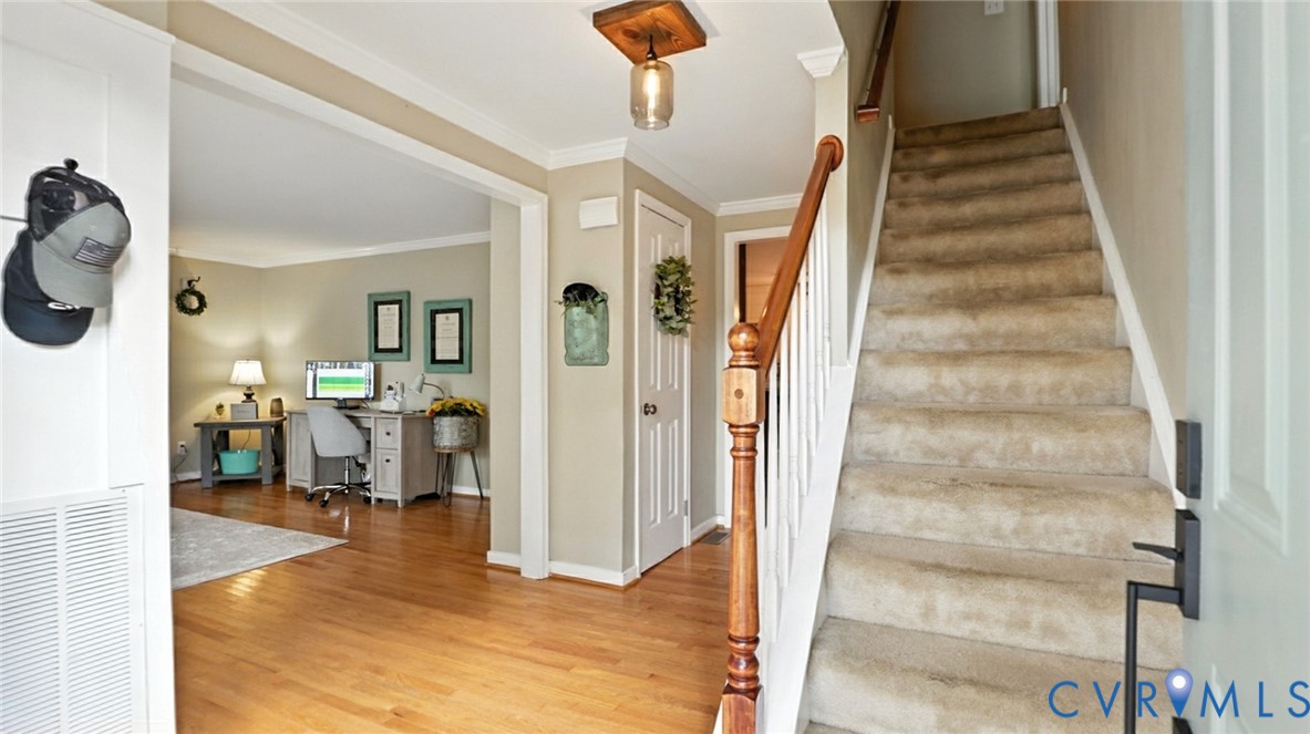 9743 Snowhill Road Richmond, VA 23235 - Photo 3 of 48 Staircase with wood finished floors and ornamental