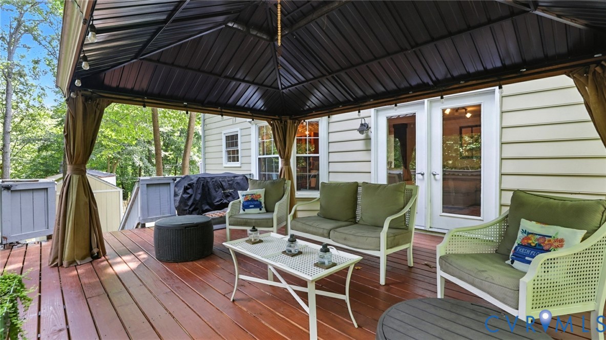 9743 Snowhill Road Richmond, VA 23235 - Photo 41 of 48 Wooden deck with an outdoor hangout area, a gazebo