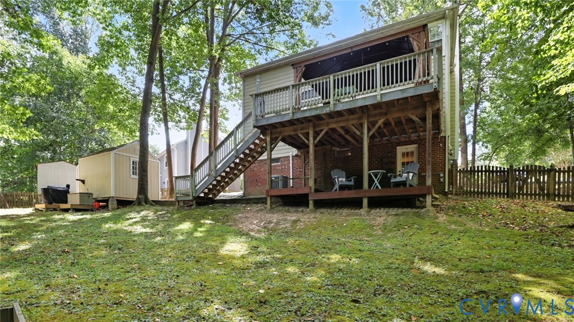 9743 Snowhill Road Richmond, VA 23235 - Photo 44 of 48 Back of house featuring a wooden deck, stairway, a
