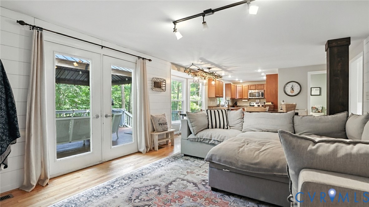 9743 Snowhill Road Richmond, VA 23235 - Photo 6 of 48 Living area with french doors, light wood finished