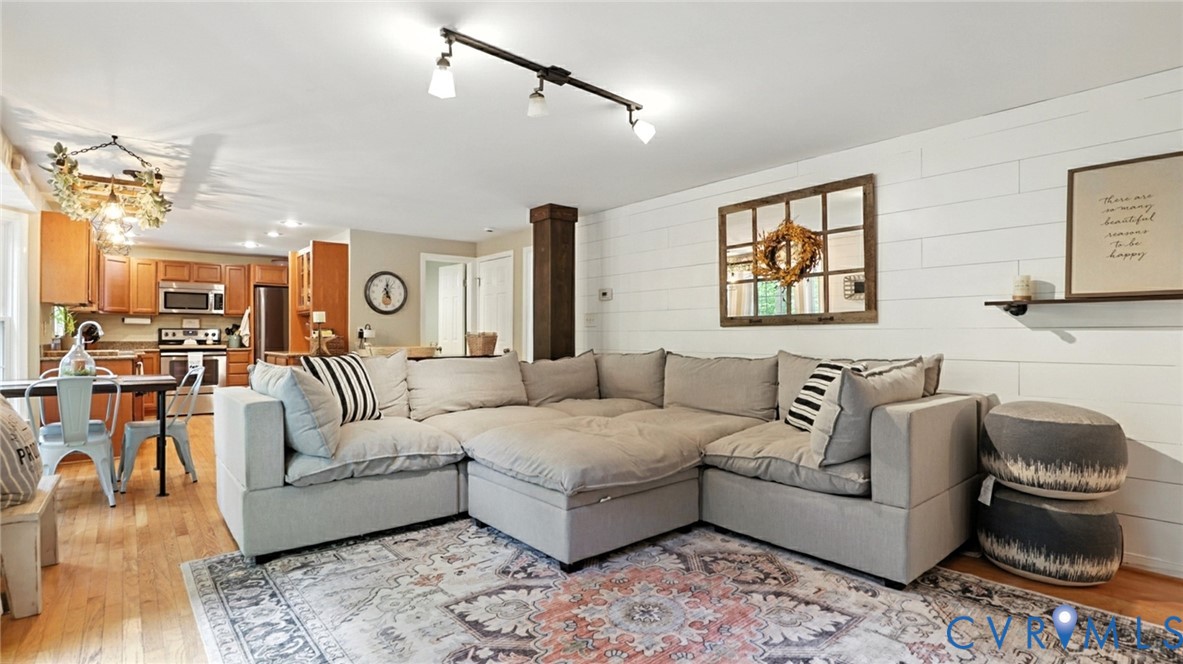 9743 Snowhill Road Richmond, VA 23235 - Photo 7 of 48 Living area with light wood-type flooring, wooden