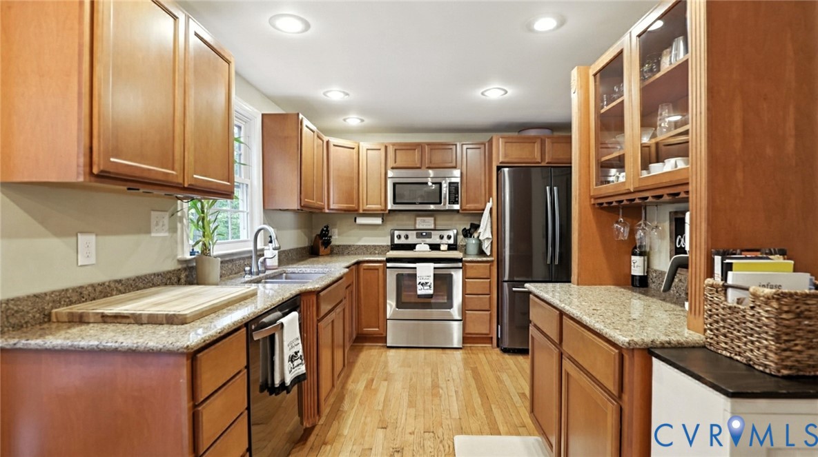9743 Snowhill Road Richmond, VA 23235 - Photo 10 of 48 Kitchen featuring glass insert cabinets, appliance