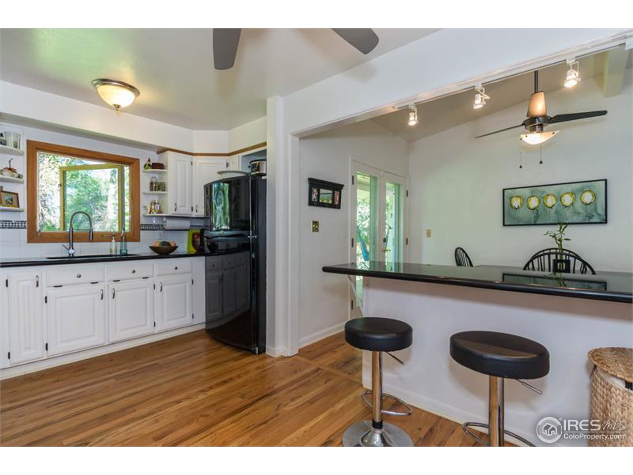 724 Gapter Road Boulder, CO 80303 - Photo 7 of 20 a kitchen with cabinets table and chairs