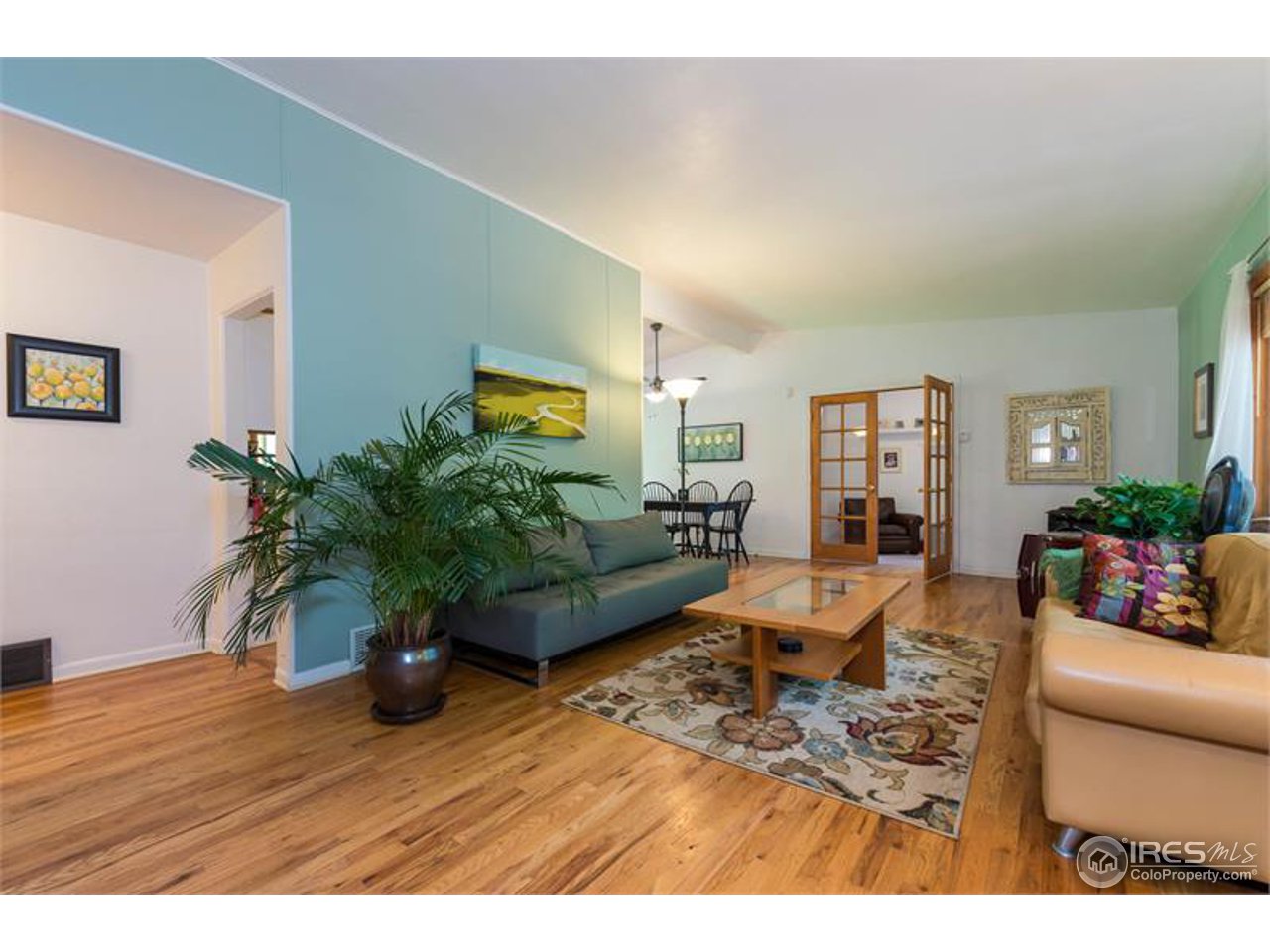 724 Gapter Road Boulder, CO 80303 - Photo 9 of 20 a living room with furniture potted plant and a wooden floor