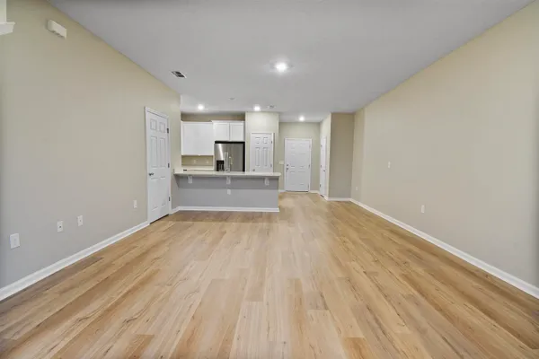 a view of kitchen and wooden floor