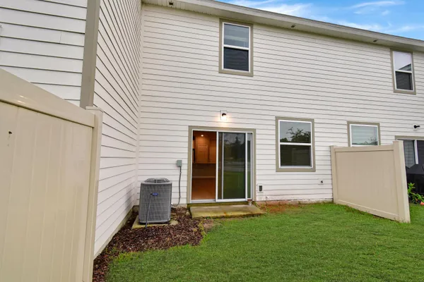 a view of a back yard of the house
